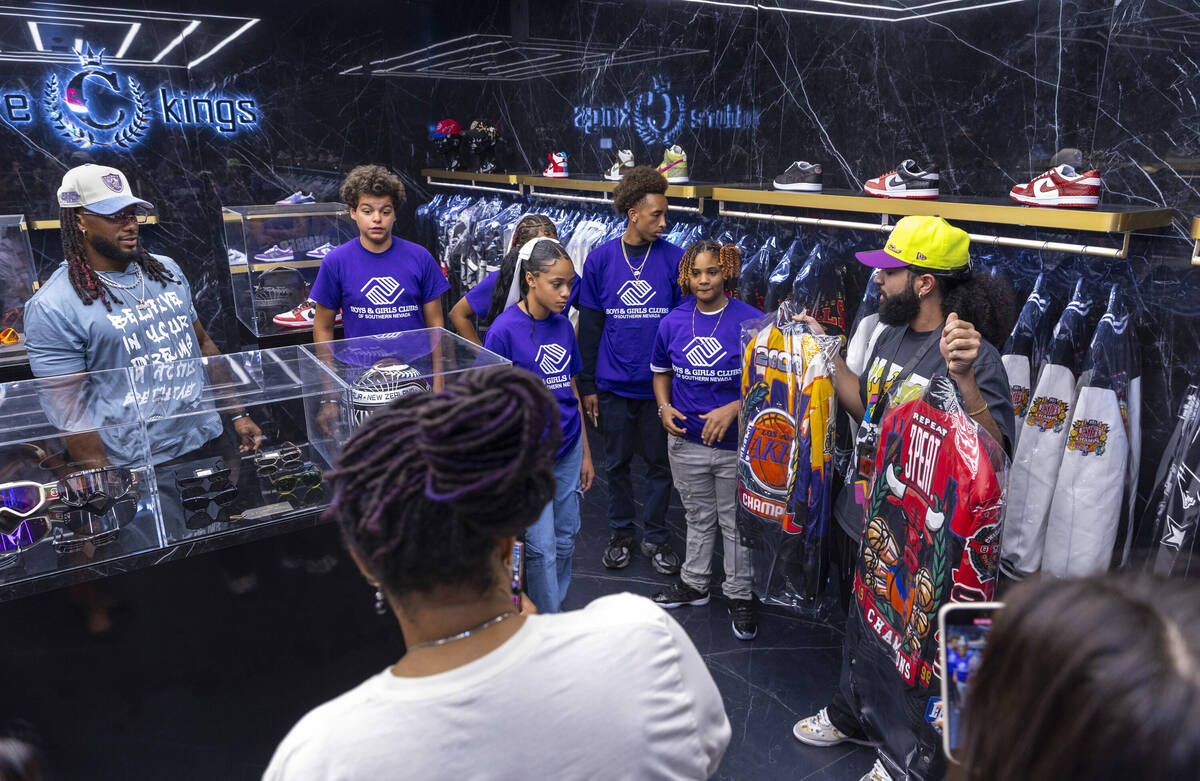 Tour guide Gio Peralte, right, shows teens from the Boys & Girls Clubs of Southern Nevada a ...