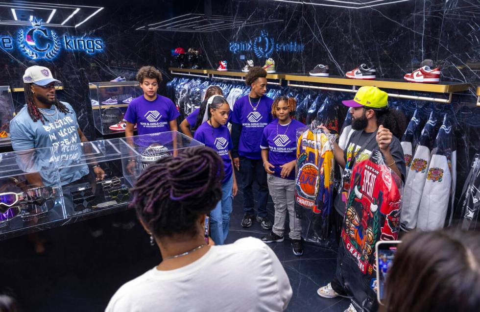 Tour guide Gio Peralte, right, shows teens from the Boys & Girls Clubs of Southern Nevada a ...