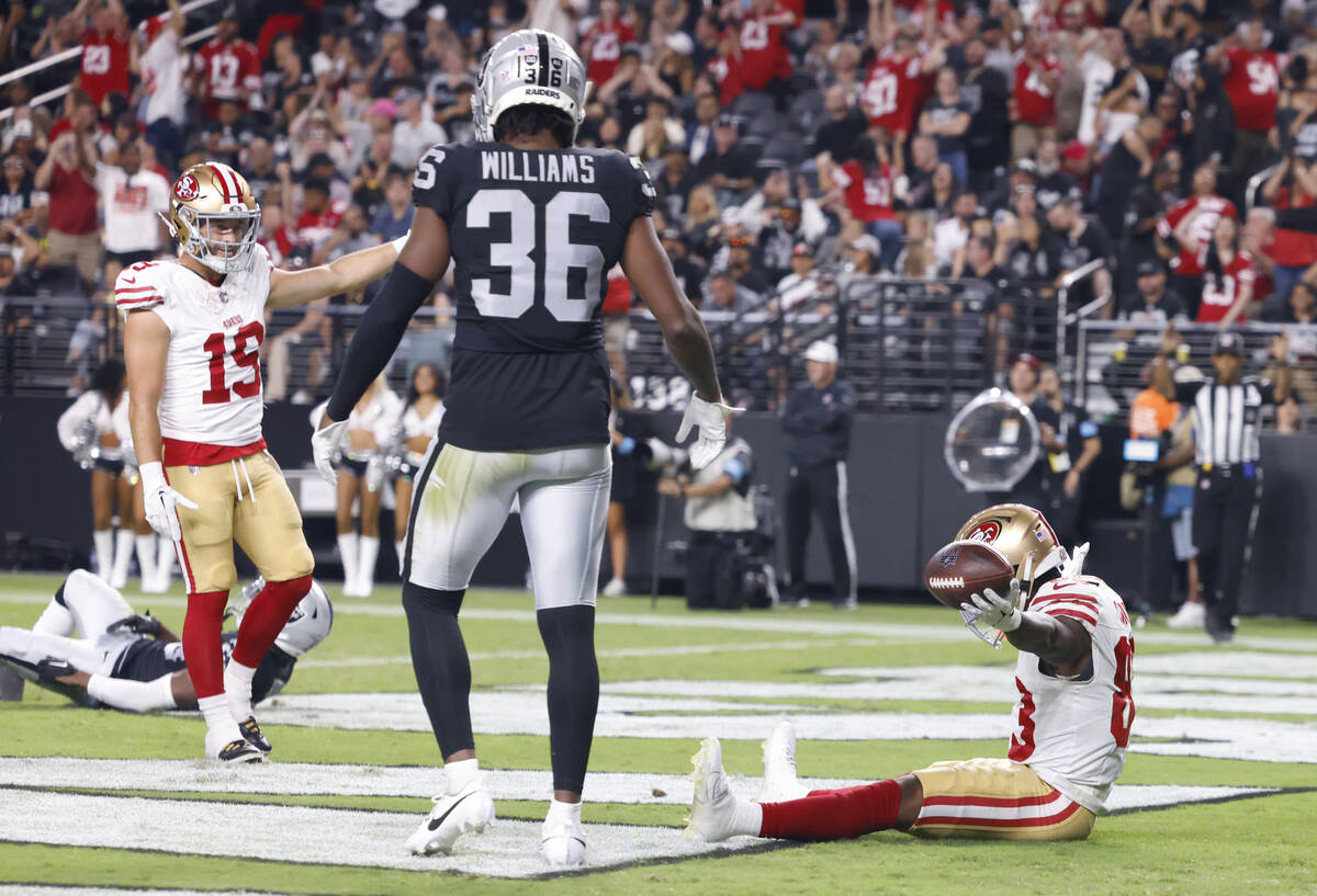 San Francisco 49ers wide receiver Jacob Cowing (83) celebrates his touchdown with his teammate ...