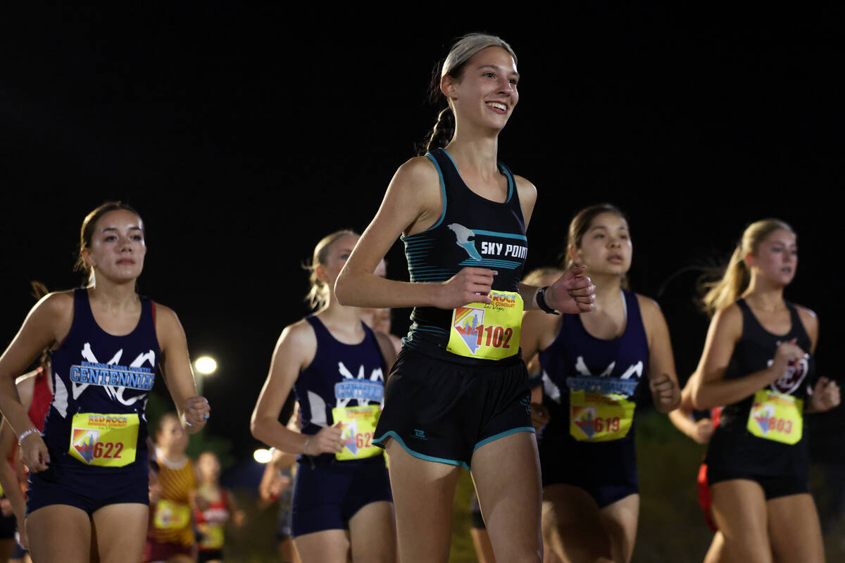 Sky Pointe’s Katherine Hodges, center, smiles while running in the Red Rock Running Comp ...