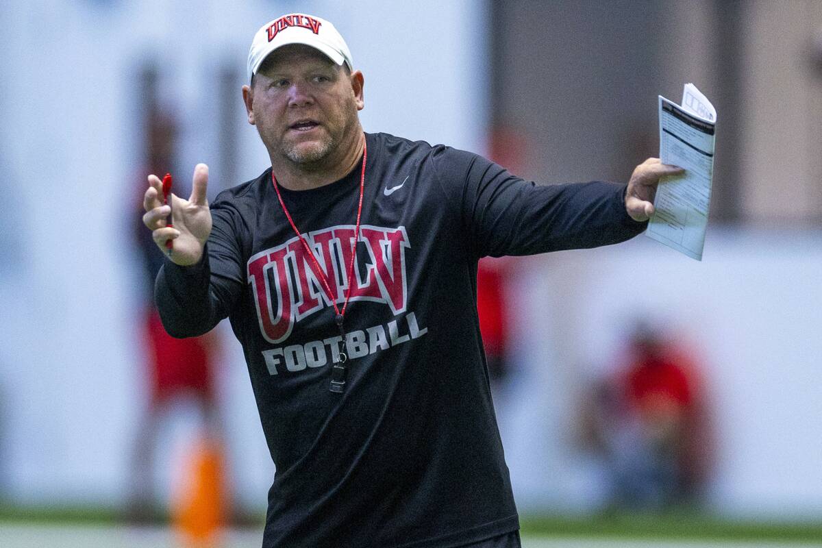 UNLV head coach Barry Odom instructs his players during football practice at the Intermountain ...