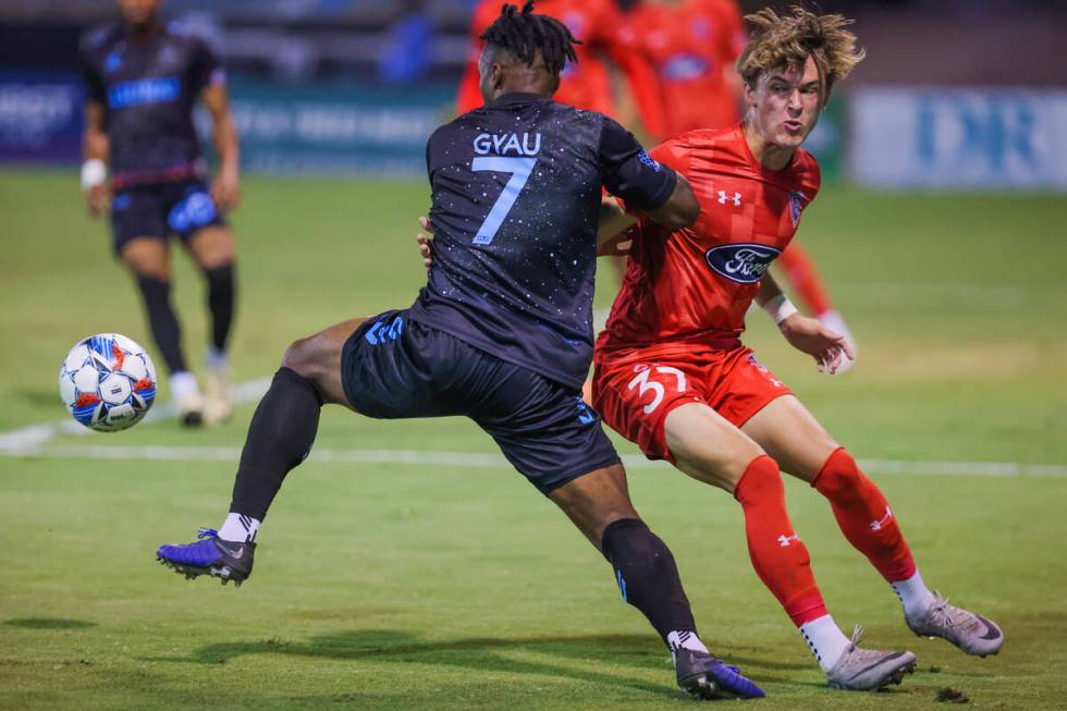 Lights FC midfielder Joseph-Claude Gyau (7) and Indy Eleven defender Logan Neidlinger (37) rac ...