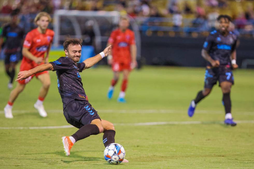 Lights FC defender Grayson Doody (2) kicks the ball toward the net during a soccer game between ...