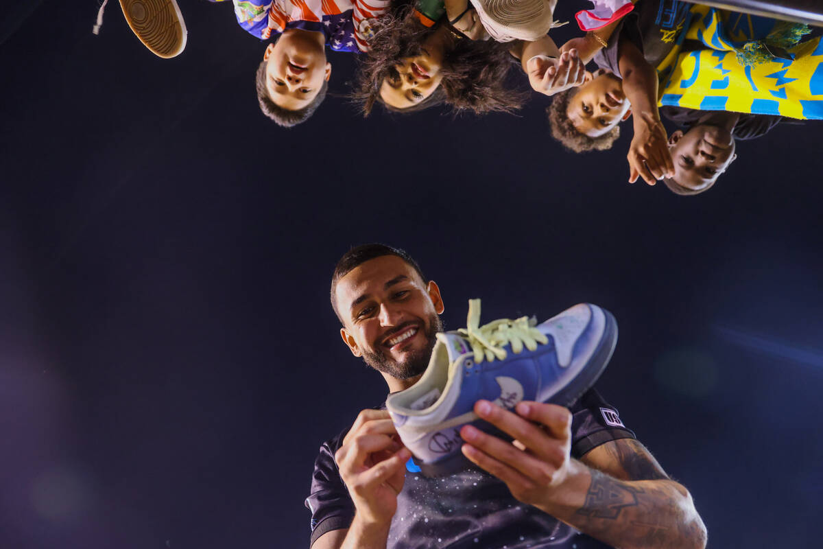 Lights FC midfielder Christian Pinzon signs a shoe for a fan following a soccer game between th ...