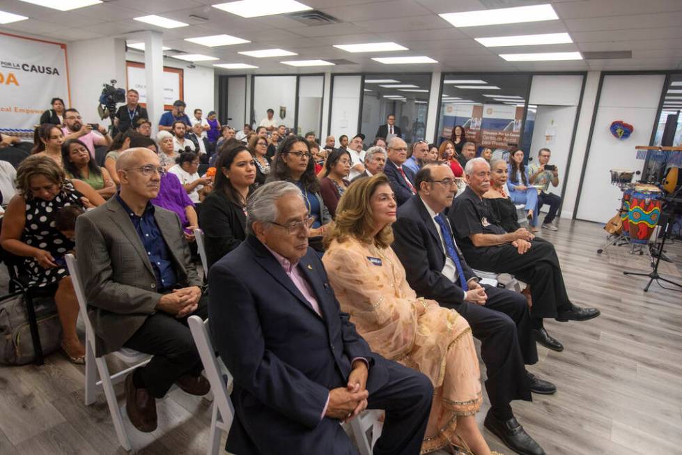 Members of the crowd listen to different speakers during the unveiling of the bust sculpture of ...