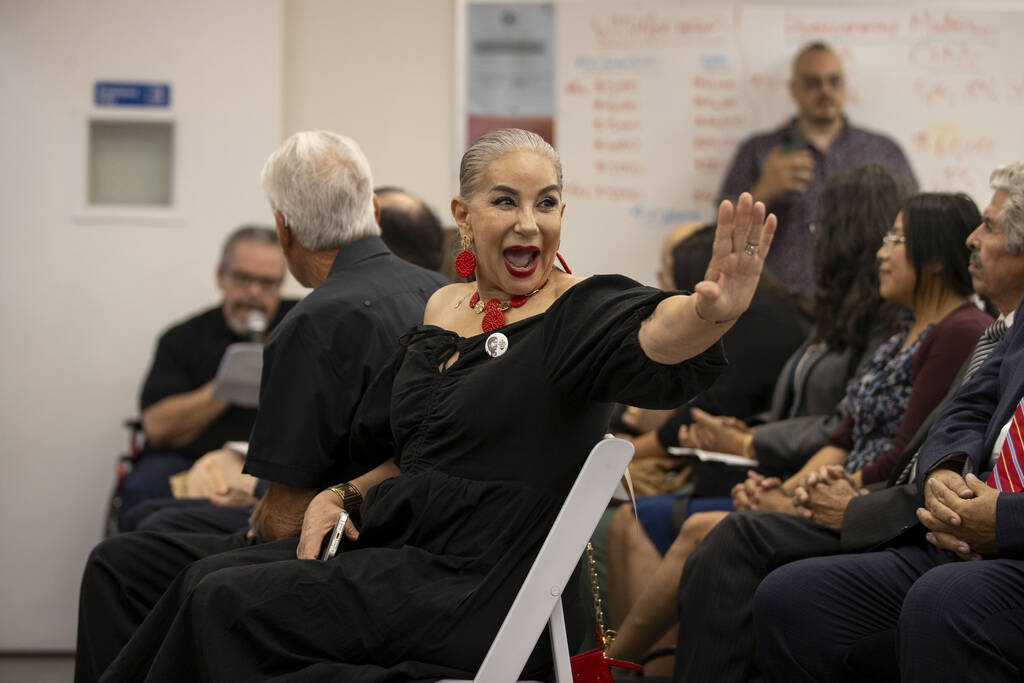 Noemi Quintero, Cesar Chavez’s niece, waves to a member in the crowd during the unveilin ...