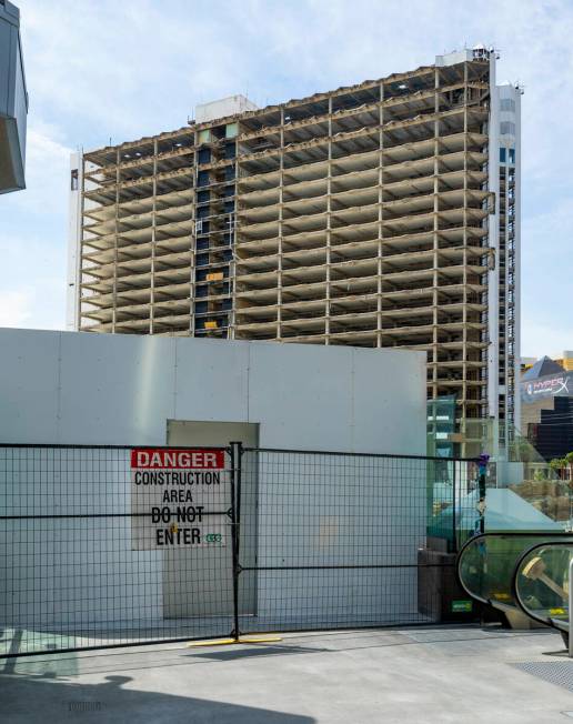 A pedestrian bridge near the MGM Grand is temporarily blocked off as the demolition of the Trop ...