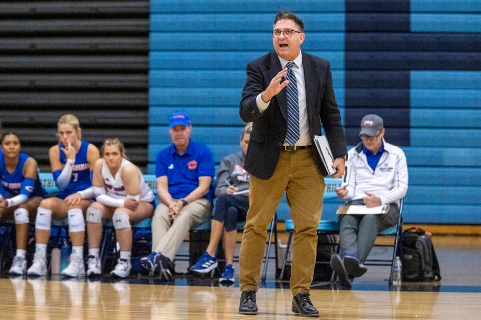 Bishop Gorman Head Coach Gregg Nunley talks to his players before a serve during the volleyball ...