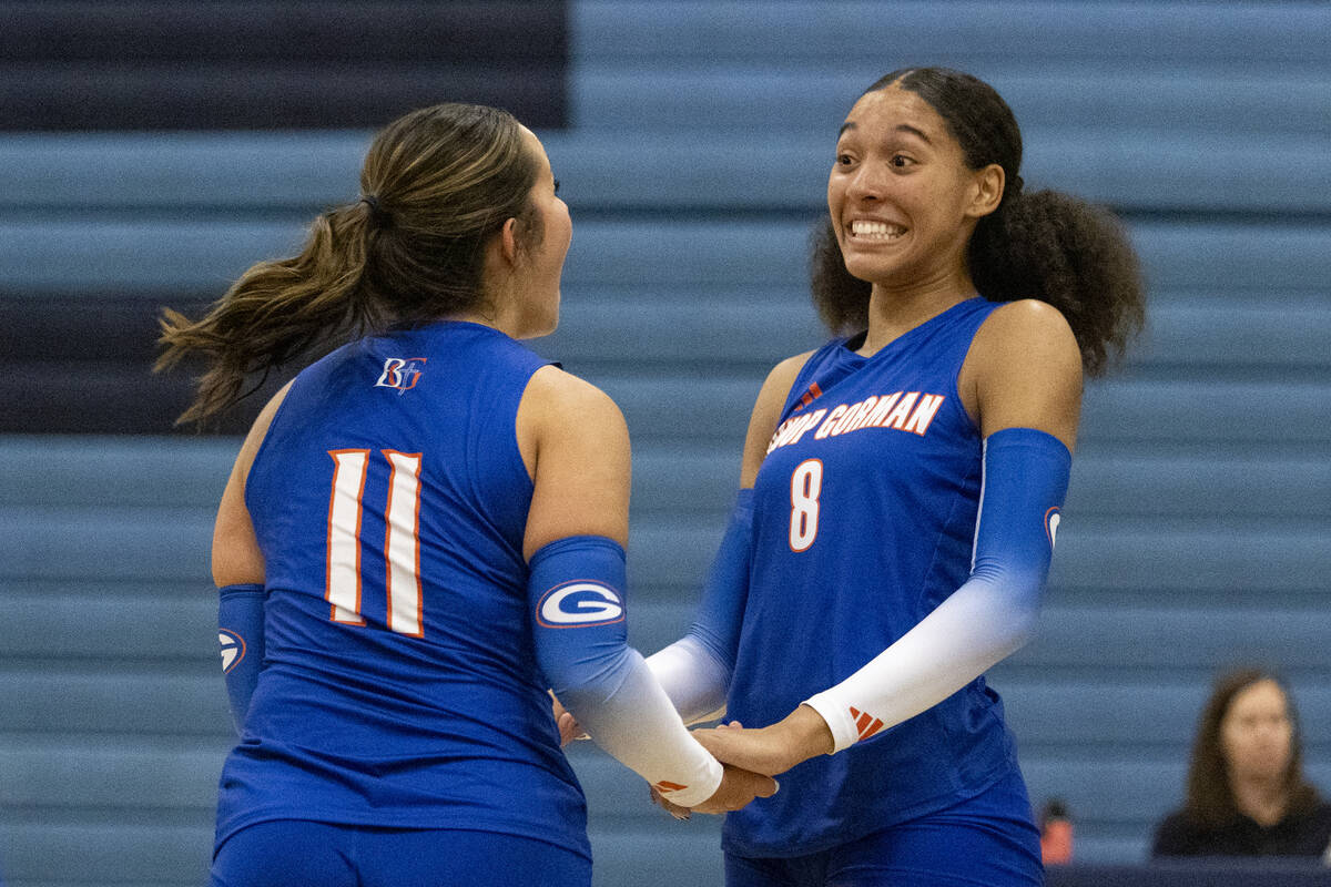 Bishop Gorman senior Alexa Ham (11) and junior Ayanna Watson (8) celebrate a point during the v ...