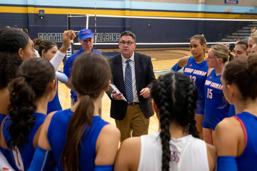 Bishop Gorman Head Coach Gregg Nunley talks to the team during the volleyball match against Foo ...