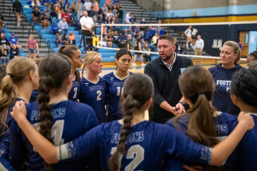 Foothill Head Coach Chris Sisson talks to the team during the volleyball match against Bishop G ...