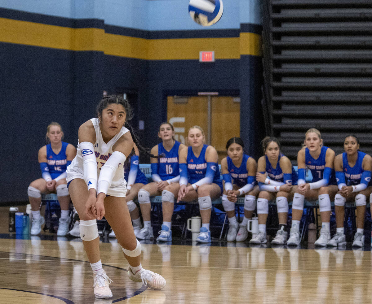 Bishop Gorman sophomore Chloe Lopez (13) receives the ball during the volleyball match against ...