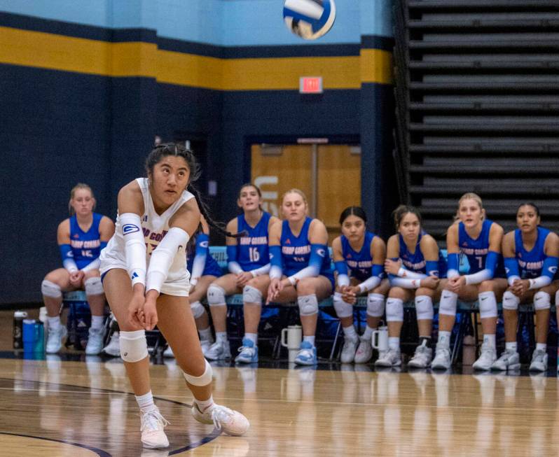 Bishop Gorman sophomore Chloe Lopez (13) receives the ball during the volleyball match against ...