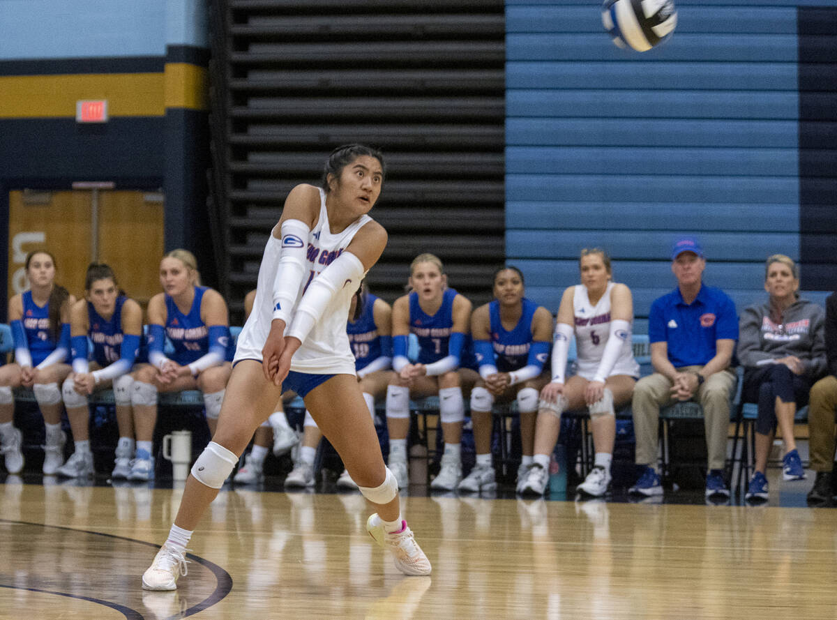 Bishop Gorman sophomore Chloe Lopez (13) receives the ball during the volleyball match against ...