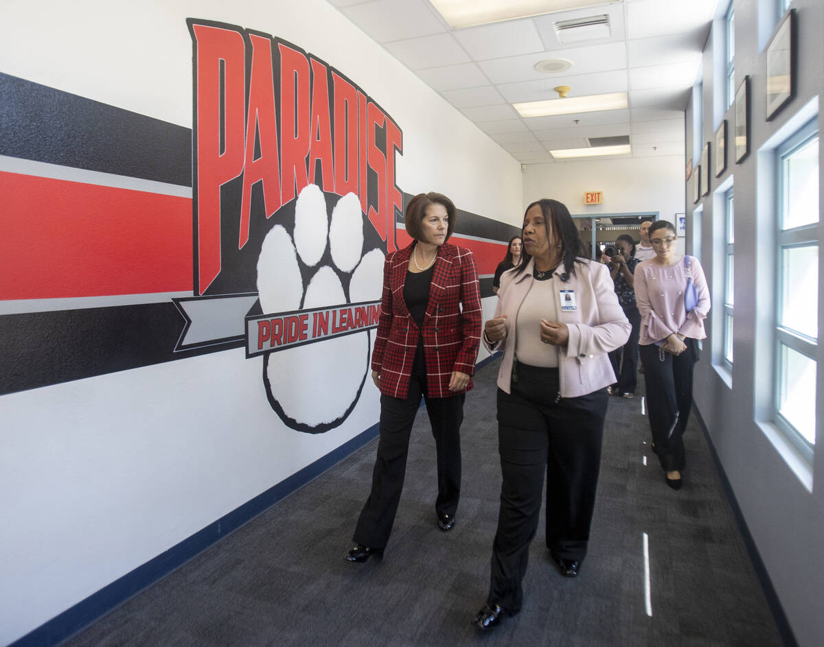 U.S. Sen. Catherine Cortez Masto, D-Nev., left, is taken on a walk-through by Principal Pamela ...