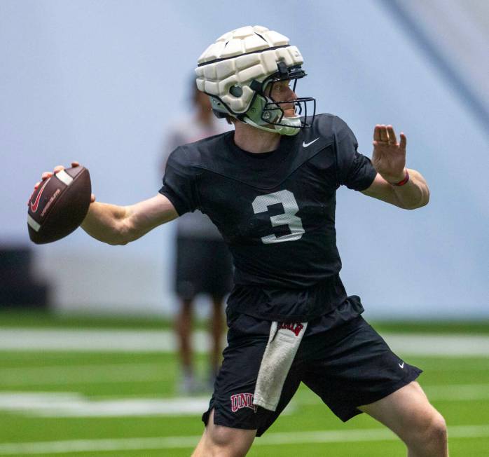 UNLV quarterback Matthew Sluka (3) eyes a receiver during football practice at the Intermountai ...