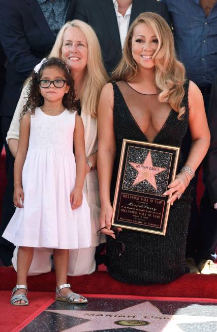 FILE - Mariah Carey appears with her mother Patricia and daughter Monroe during a ceremony hono ...