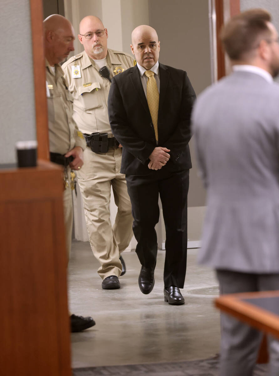 Robert Telles arrives in court from an in custody area for a hearing regarding juror questions ...