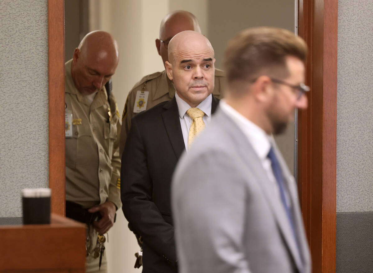 Robert Telles arrives in court from an in custody area for a hearing regarding juror questions ...