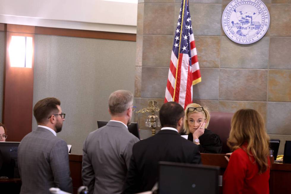 District Judge Michelle Leavitt addresses, from left, defense attorneys Michael Horvath, Robert ...