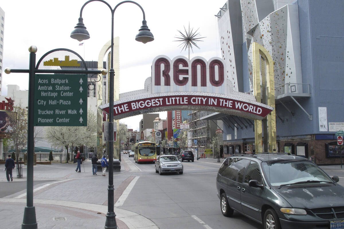 Pedestrians and traffic on Virginia Street in downtown Reno. The U.S. Postal Service announced ...