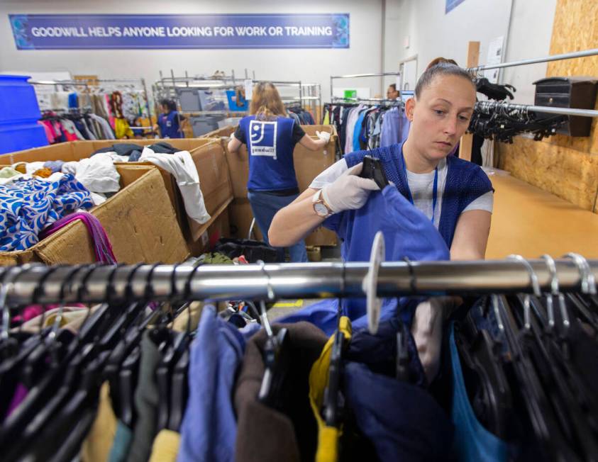 Katie Silber sorts donated clothing at Goodwill of Southern Nevada on Wednesday, Jan. 29, 2020, ...