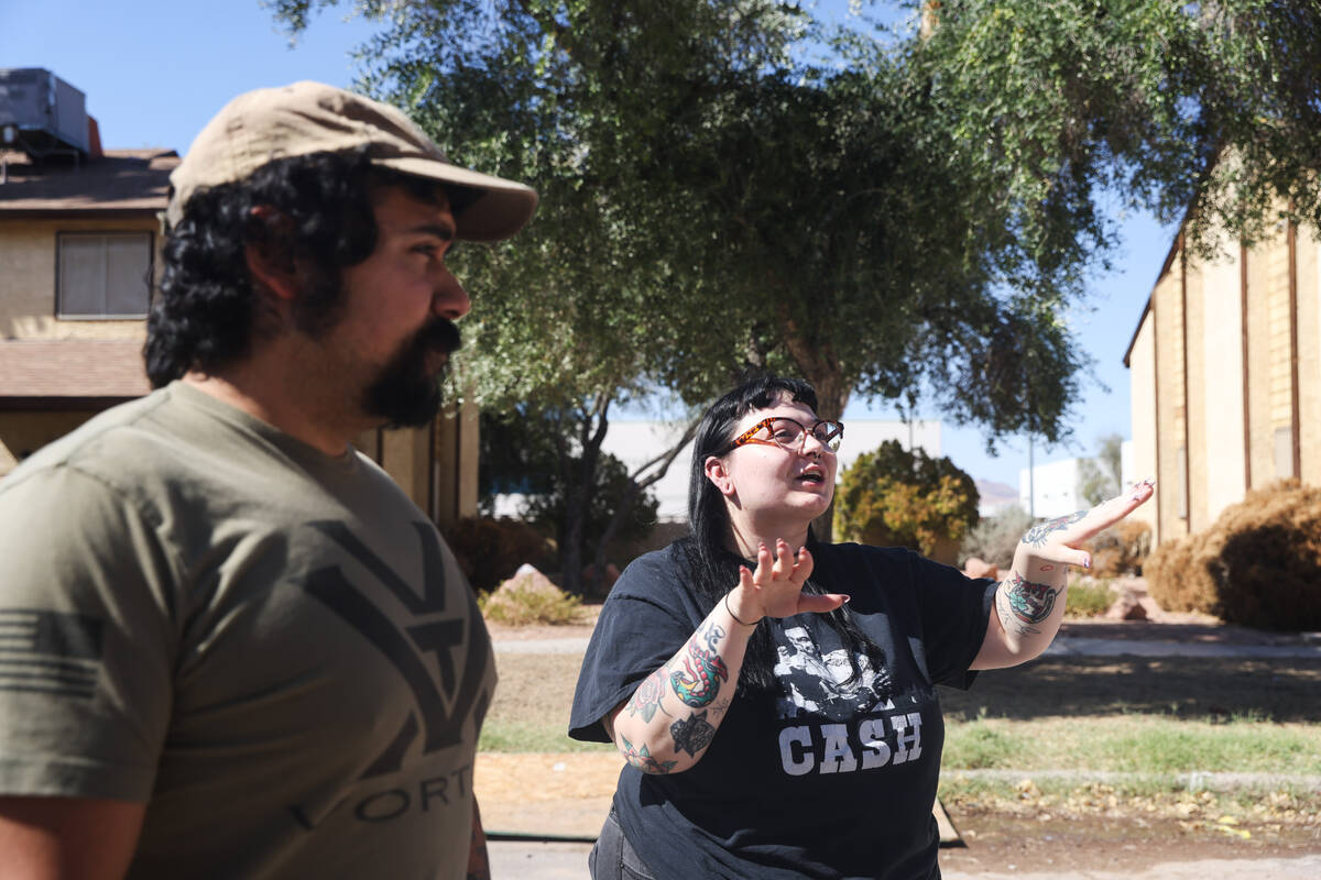 Sarah Martinez speaks to the Review-Journal as her husband Rick Martinez looks on while walking ...