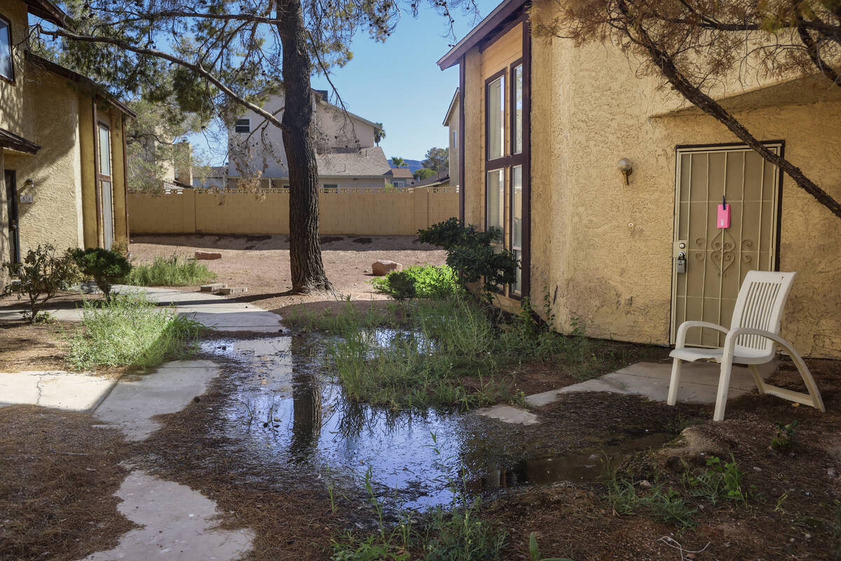 Water pools between townhomes in Somerset Park in Henderson, Tuesday, Aug. 27, 2024. Residents ...