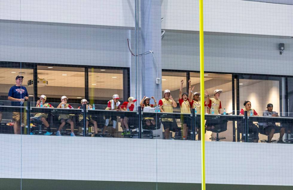 Paseo Verde players, coaches and others watch Raiders practice from the balcony at the Intermou ...