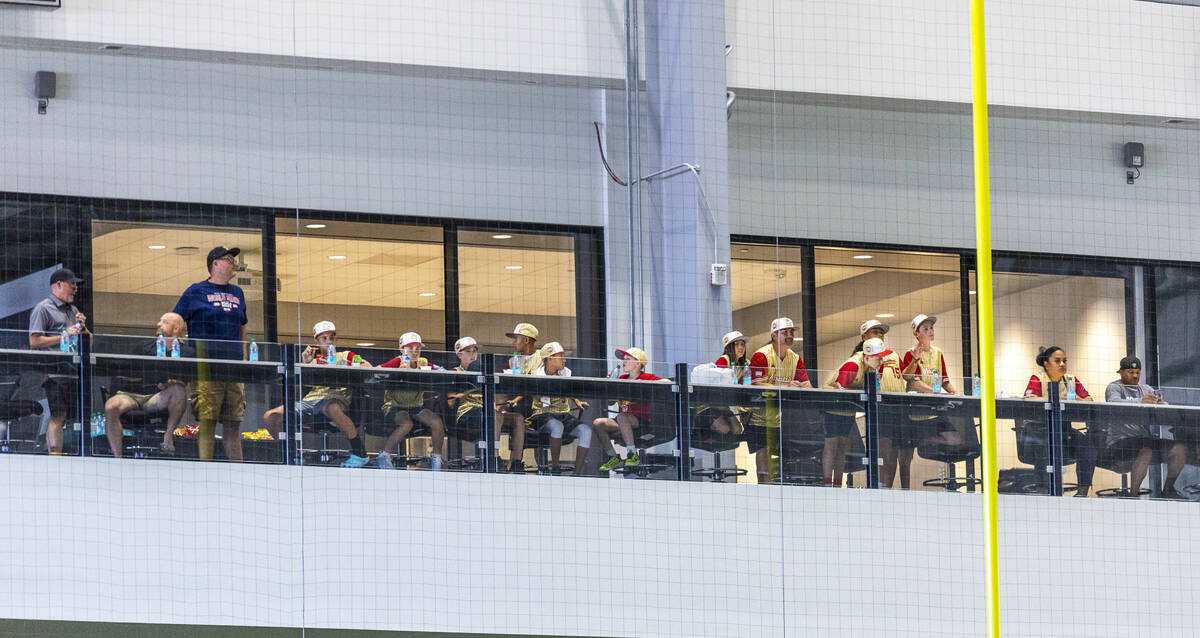 Paseo Verde players, coaches and others watch Raiders practice from the balcony at the Intermou ...