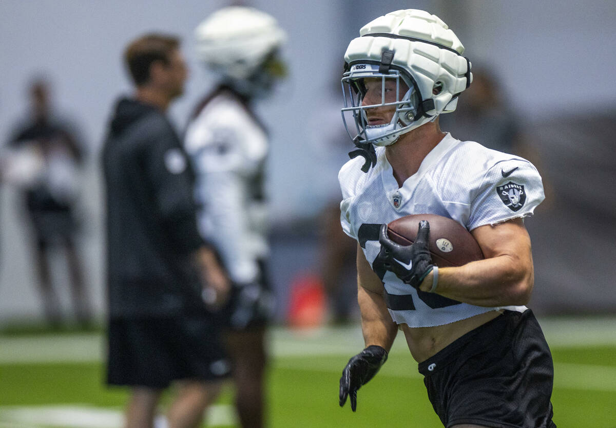 Raiders running back Dylan Laube (23) runs the ball during practice at the Intermountain Health ...