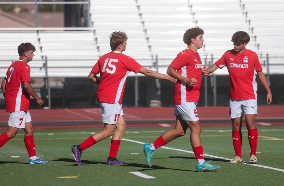 Coronado players celebrate a goal by Ben Aronow (15) during a soccer game against Cimarron-Memo ...