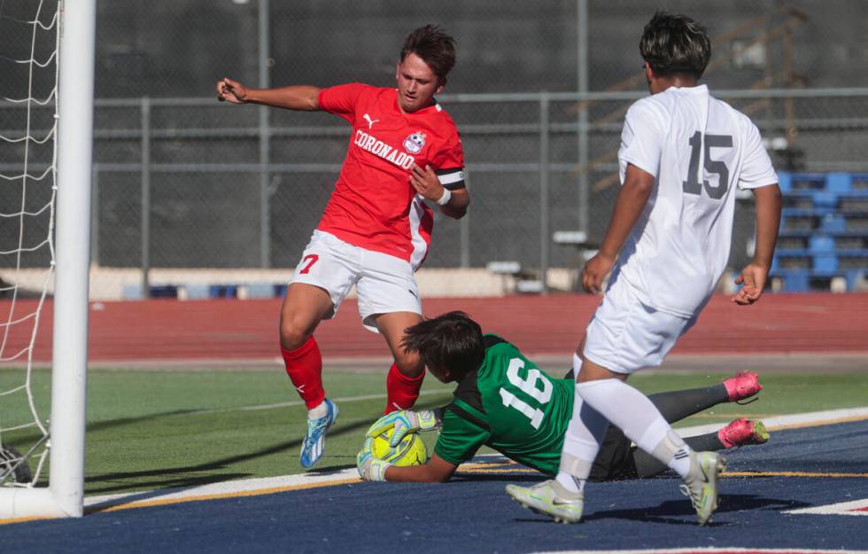 Cimarron-Memorial's goalkeeper Jose Martin (16) stops the ball against Coronado's Austin Kierna ...