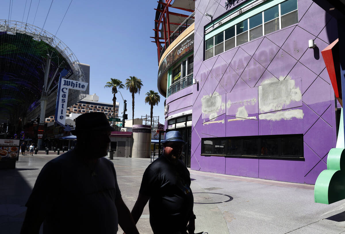 Construction is under way as pedestrians walk past the new Fat Sal's Deli, right, at 450 Fremon ...