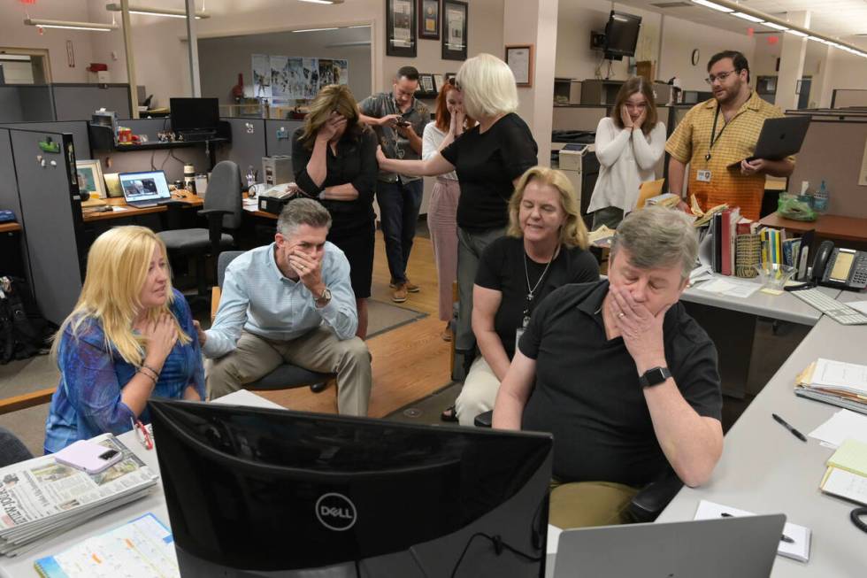 Las Vegas Review-Journal employees react in their newsroom as a guilty verdict is read for Robe ...