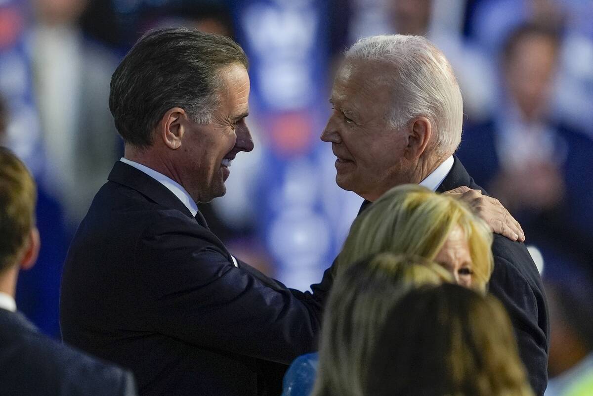 President Biden hugs his son Hunter Biden during the Democratic National Convention Monday, Aug ...