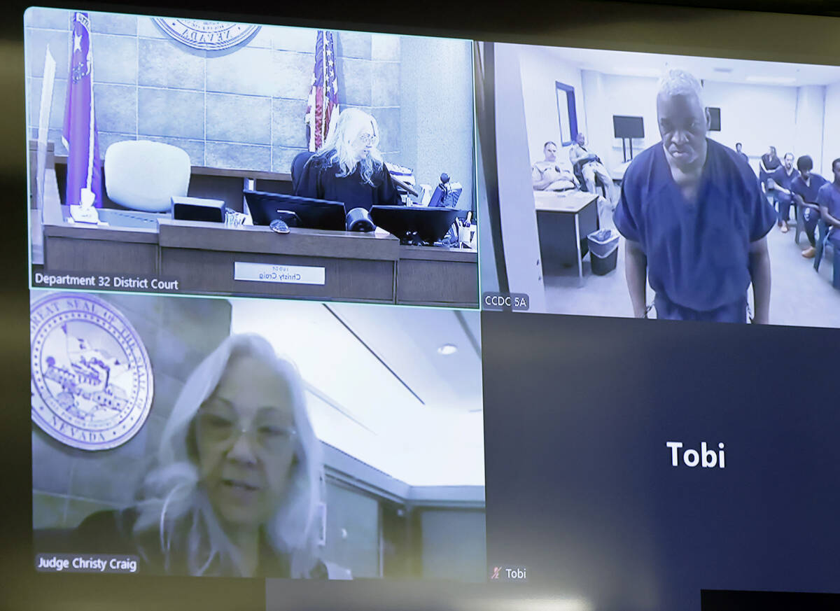 Judge Christy Craig, left, presides over a videoconference hearing for Oris Jones, right, accus ...