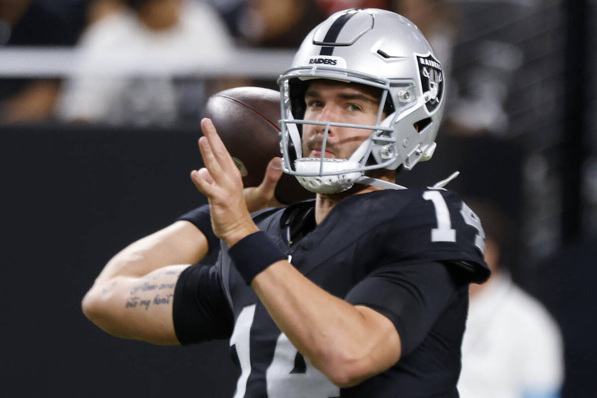 Raiders quarterback Carter Bradley (14) throws the ball as he warms up to face San Francisco 49 ...