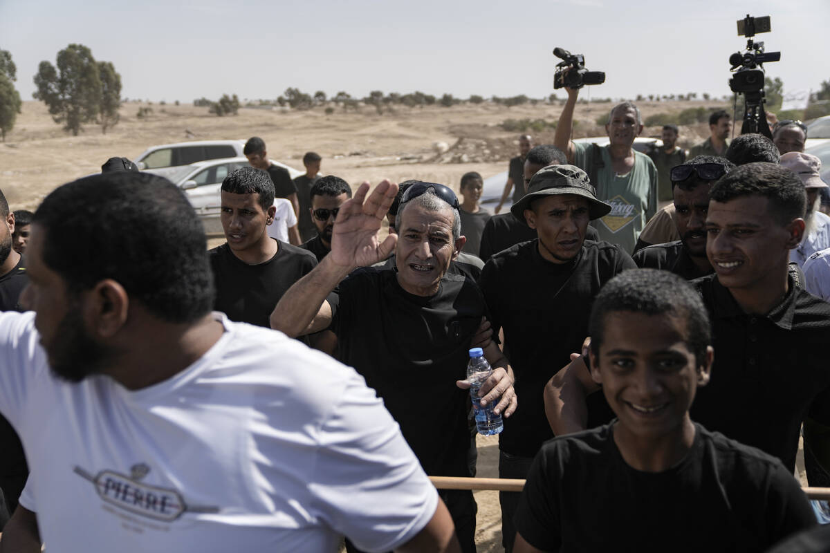 Qaid Farhan Alkadi, 52, center, who was held hostage by Hamas militants in Gaza Strip, meets hi ...