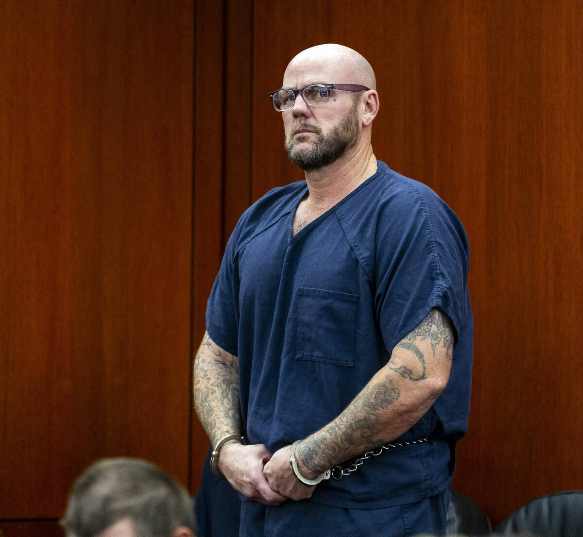 Defendant Ricky Lee Trader stands before the judge during a hearing on an emergency petition fi ...