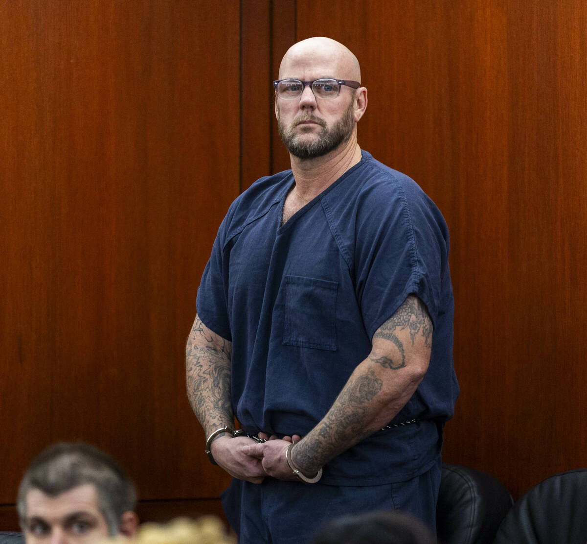 Defendant Ricky Lee Trader stands before the judge during a hearing on an emergency petition fi ...