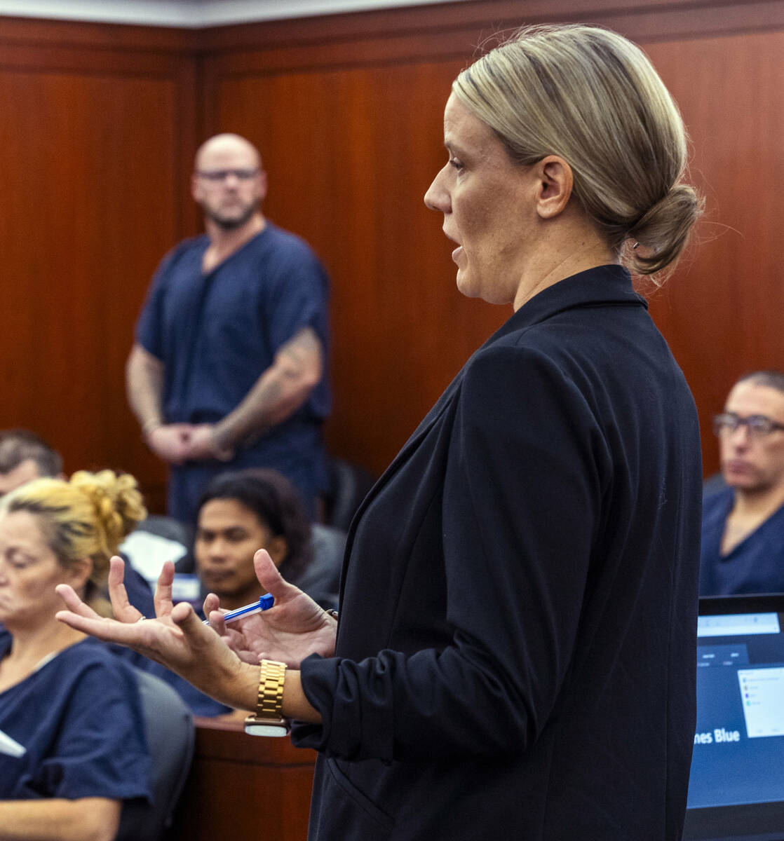 Attorney Anna Clark speaks as defendant Ricky Lee Trader stands during a hearing on an emergenc ...