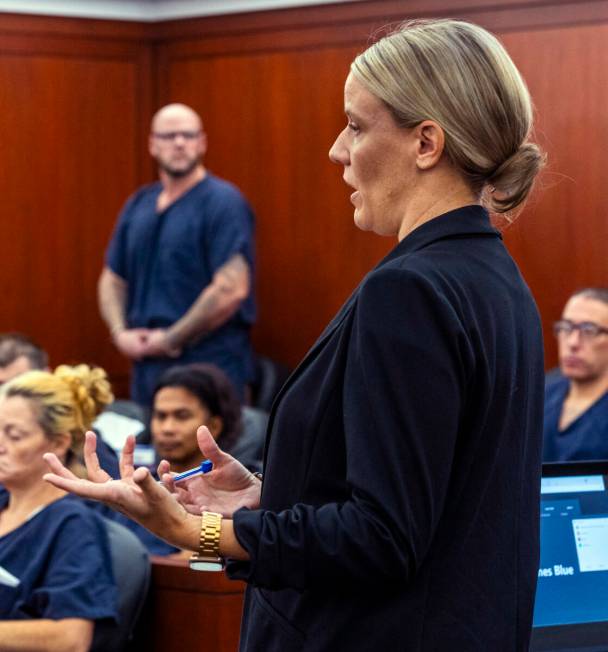 Attorney Anna Clark speaks as defendant Ricky Lee Trader stands during a hearing on an emergenc ...