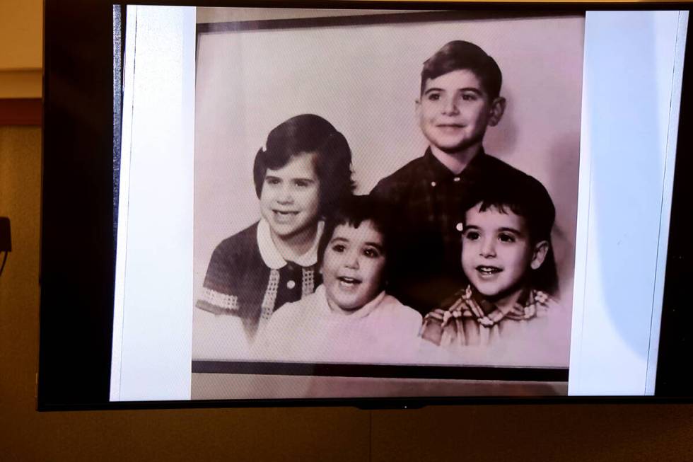 A family photo of Jeff German, top, and his siblings is shown in court during the penalty phase ...