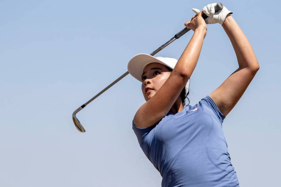 Bishop Gorman’s Francine Paloma watches her ball fly down the fairway during the Class 5 ...