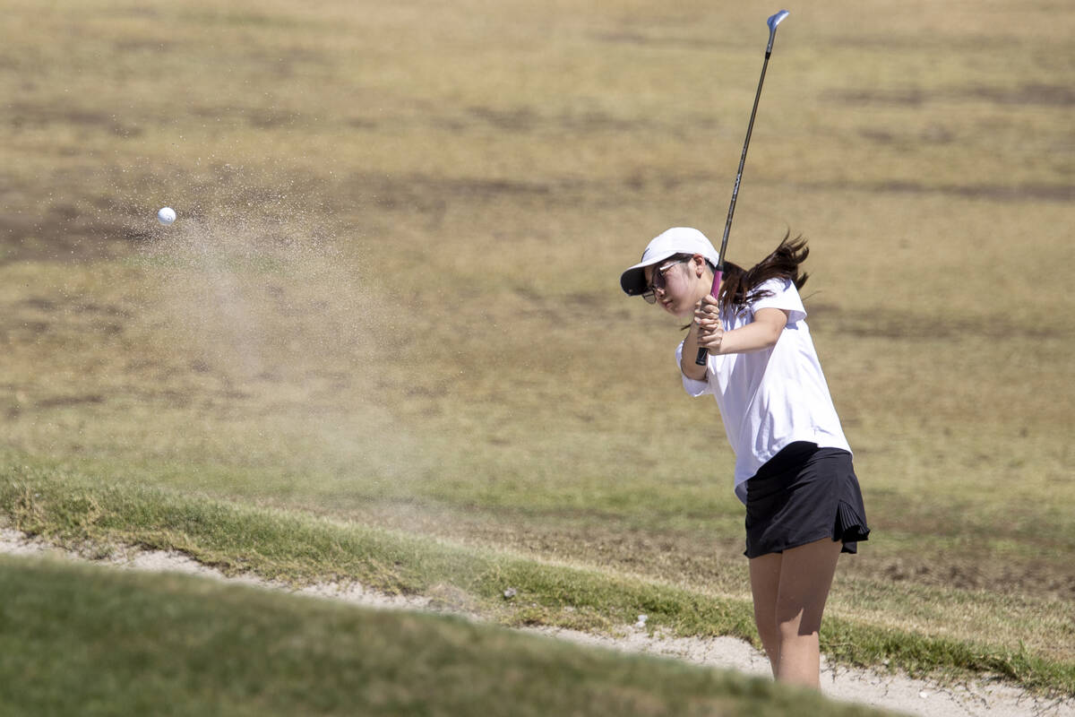 Clark’s Audrey Lac attempts to chip out of a bunker during the Class 5A Mountain League ...