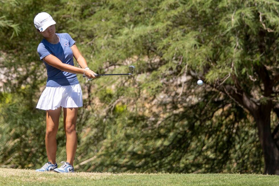 Bishop Gorman’s Sol Choi chips her ball onto the green during the Class 5A Mountain Leag ...