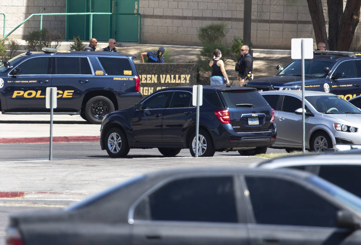 Clark County School District Police Department officers are seen outside of Green Valley High S ...