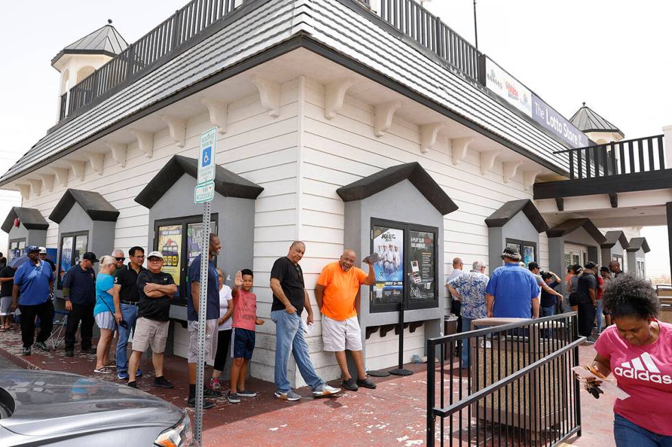 People line up outside of the Primm Valley Lotto Store to buy the Mega Million lottery tickets, ...