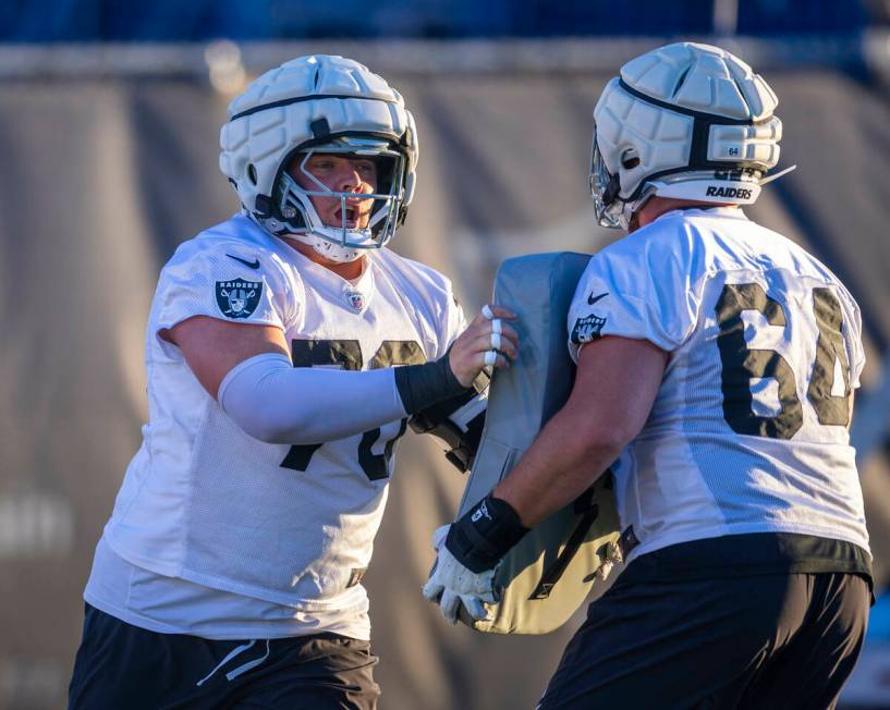 Raiders guard Jackson Powers-Johnson (70) and guard Clark Barrington (64) on a drill during pra ...